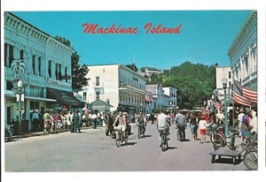 MACKINAC ISLAND Main Street Scene Bicycles American Flags MI Michigan Postcard - Picture 1 of 2
