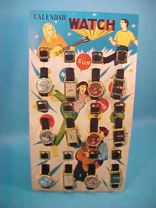 VINTAGE 12 TIN CALENDAR WATCHES on RETAIL CARD JAPAN NOVELTY 1960s NEW OLD STOCK - Picture 1 of 8