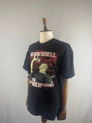 De colección WWE ¿HUELLES lo que la roca está cocinando? Camiseta Talla XL Negra Foto 1 de 4