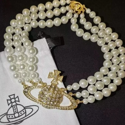 Collana girocollo Vivienne Westwood perle triplo tono oro sfera bassorilievo scatola