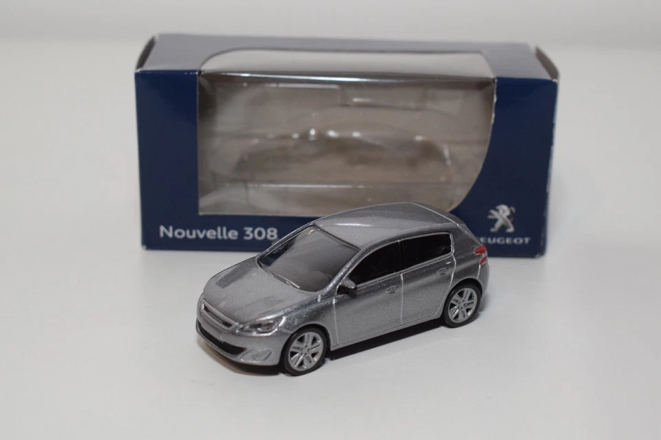 B86 1:64 3 INCH 3 INCH NOREV 314815 PEUGEOT 308 5 PORTE PORTE MET. GRIGIO MIB - Immagine 1 di 4