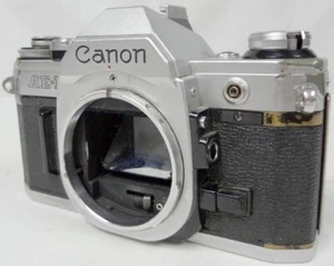 Macchina fotografica vintage argento Canon AE-1 SLR 35 mm pellicola giapponese solo corpo 4566751! - Foto 1 di 18