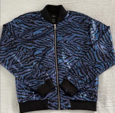 Jaqueta de lantejoulas elegante com padrão preto e azul ousado. Ideal para passeios da moda - Imagem 1 de 4