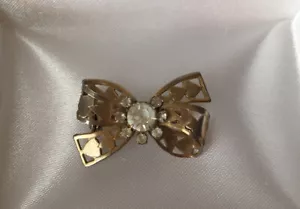 Vgt set di poli trasparenti fiocco a forma di cuore strass spilla tono oro - Foto 1 di 5
