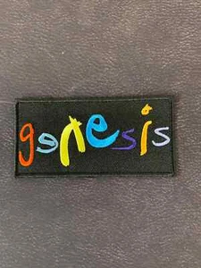 GENESIS MULTI COLOUR STANDARD LOGO WOVEN SEW ON PATCH OFFICIALLY LICENSED - Imagen 1 de 6