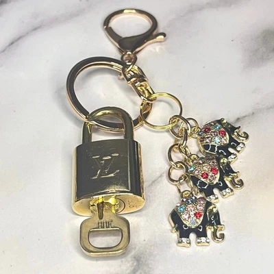 Louis Vuitton Lock & Key Set #308 with a Black Elephant Charms Keychain - Image 1 of 4