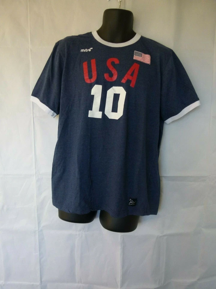 Camiseta de fútbol Mitre Elite para hombre mezcla de algodón cuello redondo firma EE. UU. 10 azul Foto 1 de 4