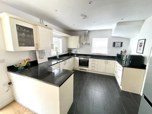 Large Cream Shaker Kitchen With Black Granite Worktops And Integrated Appliances - Picture 1 of 15