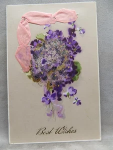 Postal Best Wishes Ramo Flores Púrpura Cinta de Seda Medalla de Oro Arte 1917 - Imagen 1 de 2
