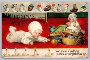 Antigua postal de Navidad de 1916 juguetes para bebés pub de arte internacional en relieve - Imagen 1 de 2