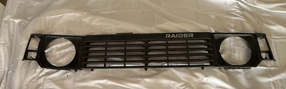 1983-1991 Dodge Raider Montero, Pajero, OEM Front Grill lamp bezel housing trim  - Image 1 of 4