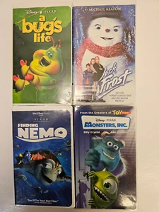 Disney Pixar WB Clamshell VHS Monsters Inc Finding Nemo, A Bugs Life, Jack Frost - Foto 1 di 13