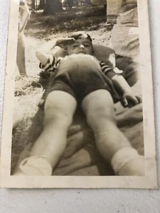Vintage Photo Young Boy Laying On Blanket In Yard Grass Saluting 1950’s Picnic - Picture 1 of 6