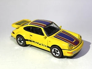 Schuco x Tarmac Works 1/64 Porsche P-911 Turbo gelb, Hot Wheels Redline - Bild 1 von 9