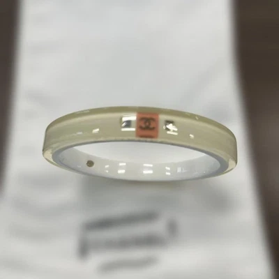 CHANEL White Acrylic Bangle with Logo & Stones Used - Image 1 of 4