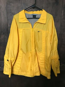 Nike gelber Windbreaker mit Reißverschluss Seitentaschen blau Logo Herren Größe L - Bild 1 von 4