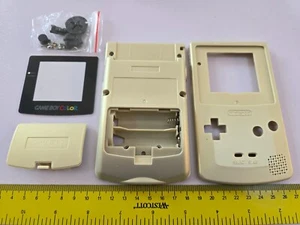KIT GUSCIO CONSOLE NINTENDO GAMEBOY COLOR RICAMBIO COMPLETO ORO CHIARO NUOVO DI ZECCA! - Foto 1 di 2