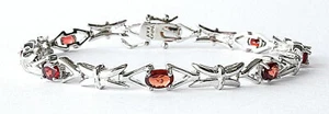 SILVER PLATED OVER BRASS OVAL GARNET TENNIS BRACELET, 8" LONG - Picture 1 of 2