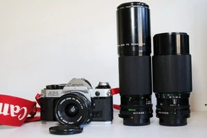 Pacchetto fotocamera Canon AE1. Inc.3 Obiettivi Obiettivi Testati LEGGI 20mm, 300mm + 70-210mm - Foto 1 di 23
