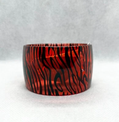 Brazalete ancho estampado cebra translúcido de plástico Foto 1 de 4