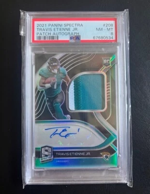 2021 Panini Spectra Travis Etienne Patch Rookie Auto 60/99 PSA 8 - Image 1 of 2
