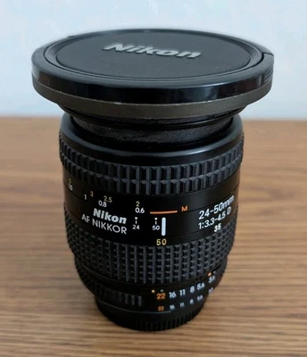 Nikon AF Nikkor 24-50 мм f/3.3-4.5 D широкий зум-объектив с крышкой и крышкой - Изображение 1 из 4