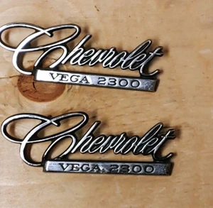 OEM Pair 1971 1972 Chevrolet Vega 2300 Emblem 9870383 - Picture 1 of 3