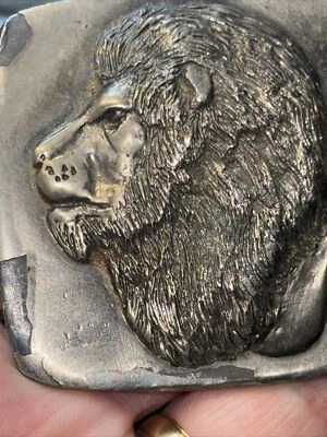 1977 Lewis Vintage Belt Buckle, Front is a Lion back scribed with a scene (look) - Image 1 of 4
