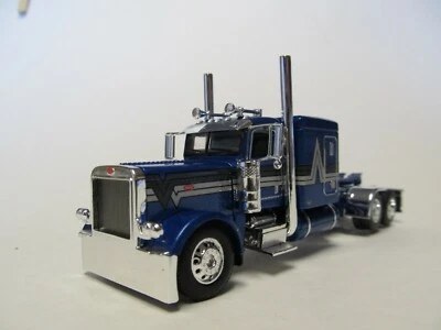 DCP FIRST GEAR 1/64 SCALE 389 PETERBILT FLAT TOP, BLUE WITH BLACK/ SILVER STRIPE - Image 1 of 4