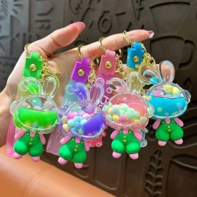 Lindo llavero de arena movediza relleno de aceite de conejo de dibujos animados - diseño acrílico de grano de azúcar Foto 1 de 3