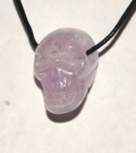Small Amethyst Skull Pendant on black cord --- Lot 1574 - Picture 1 of 3