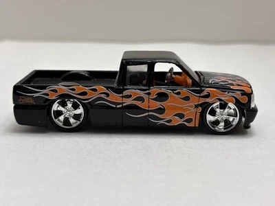 Muscle Machines Truckin’ RARE ‘97 Chevy Silverado Radillac Black Orange & Blue - Image 1 of 4