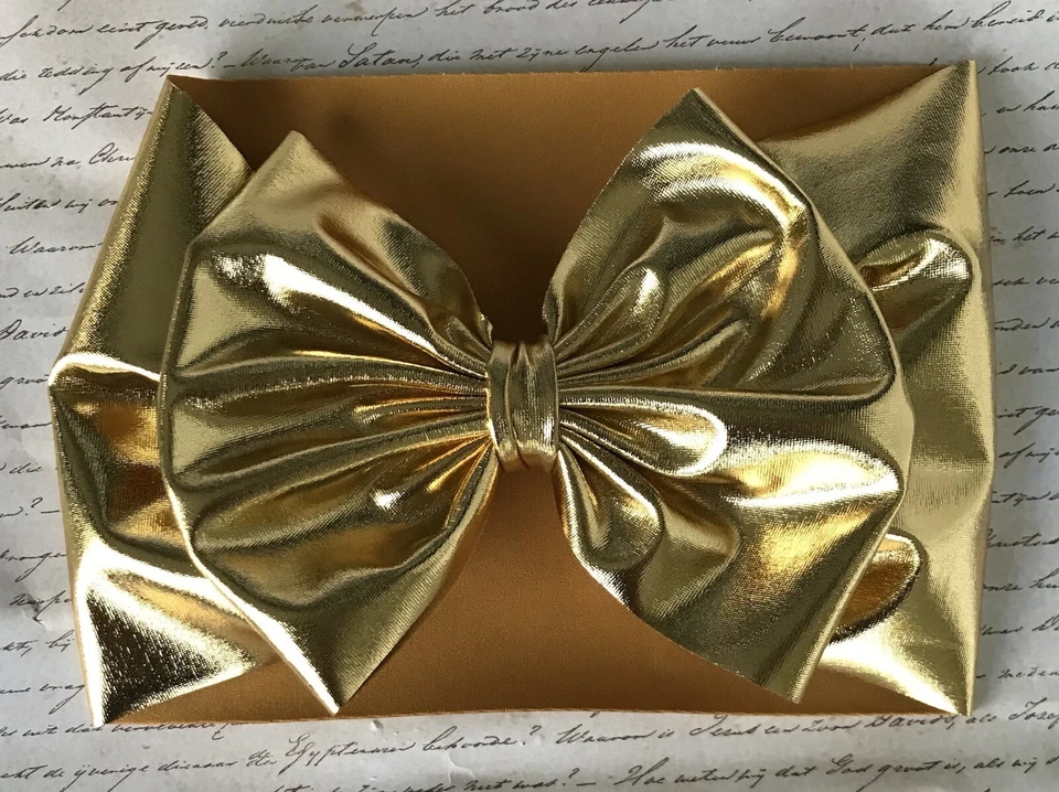 Diadema elástica de spandex cojo metálico dorado para bebé nueva con etiquetas Foto 1 de 1