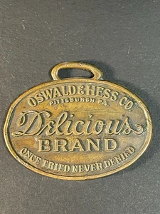 Reloj Publicitario Oswald & Hess Llavero Delicious Brand Pittsburgh PA - Imagen 1 de 6