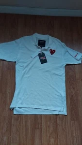 Neu mit Etikett Keith Haring Polo weißes kurzärmliges charakteristisches Herrenhemd mit Logo Medium - Bild 1 von 6
