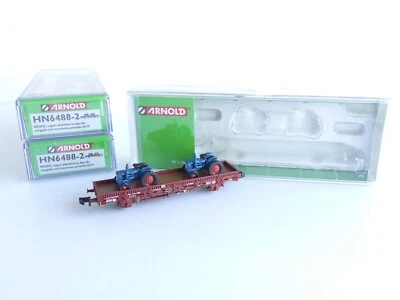 ARNOLD HN6488-2 / 3 WAGONS PLAT RENFE + 2 TRACTEURS - Imagen 1 de 4
