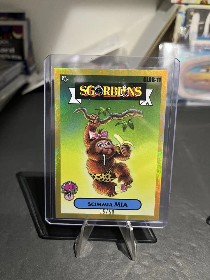 Garbage Pail Kids 40th Anniversary | Scimmia Mia | Global Takeover GLOB- 11 Gold - Image 1 of 1
