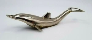 Abridor de tapas de botellas de marsopa delfín tono plateado vintage hecho en Alemania Occidental - Imagen 1 de 7