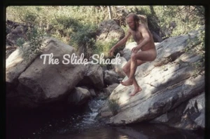 Naked man jumping off rocks into water - gay interest - original 1974 35mm slide - Picture 1 of 1