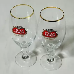 Stella Artois Calice Belgio Set 2 Bicchieri Birra Ciottoli Spiaggia Enogastronomia - Foto 1 di 6