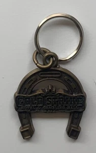 Vintage Gold Strike Hotel and Gambling Hall Keychain - Picture 1 of 2