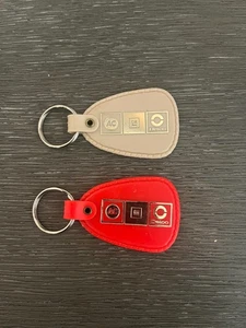 (2) Vintage AC GM Delco General Motors Keychains - Picture 1 of 2