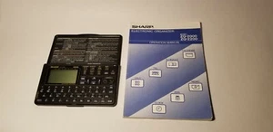 Sharp Vintage 7 Function Electronic Organizer Calculator Planner ZQ-2200 - 32KB - Picture 1 of 3