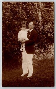 RPPC Handsome Middle Aged Man White Trousers Holding Adorable Child Postcard C25