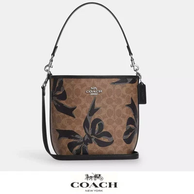 NWT 🎁 Coach City Bucket Bag In Signature Canvas With Bow Print - Image 1 of 4