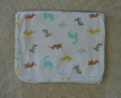 Manta bebé dinosaurio Carter's blanca jersey tejido elástico envoltura azul amarillo Foto 1 de 4