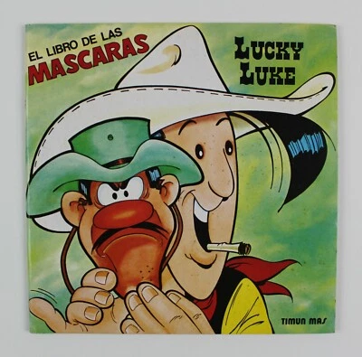 LUCKY LUKE 1985 El libro de las máscaras tapa blanda español vintage 24 cm. (9,5") ¡VHTF!! Foto 1 de 4
