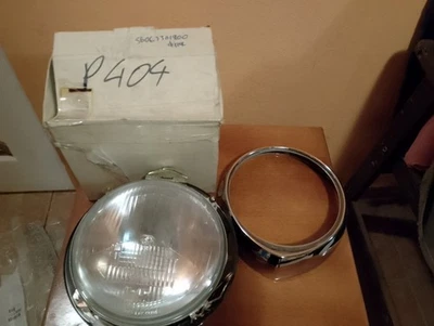 faro peugeot 404 + anillo + base NOS original Foto 1 de 4