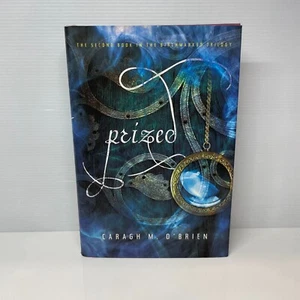 Prized by Caragh M. O'Brien (Hardcover Book) Romance, Young Adult, Dystopia - Picture 1 of 8