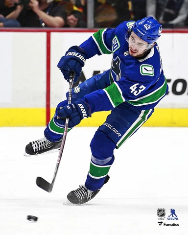 Quinn Hughes Vancouver Canucks Unsigned Blue Jersey Passing 8" x 10" Photo Cover